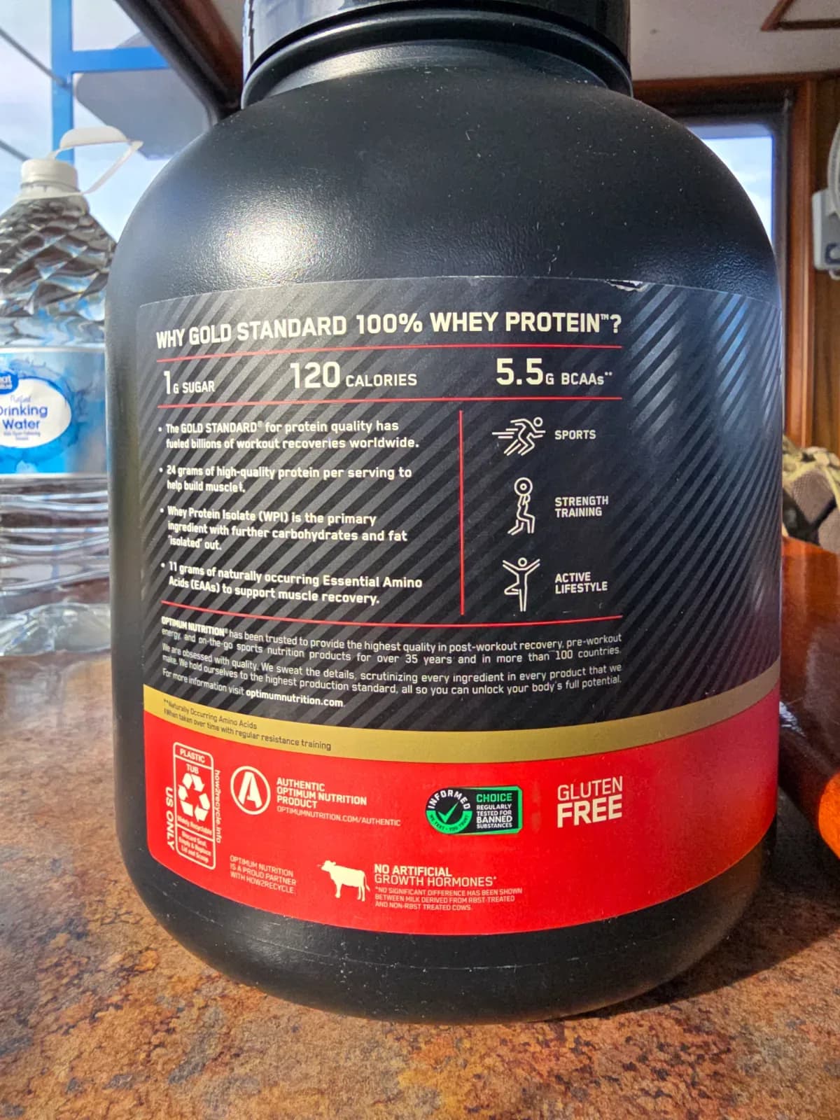 An open protein powder container showing the fine powder texture inside